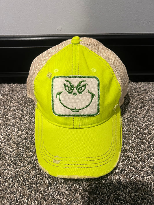 Lime green distressed Snapback hat with grinch face patch